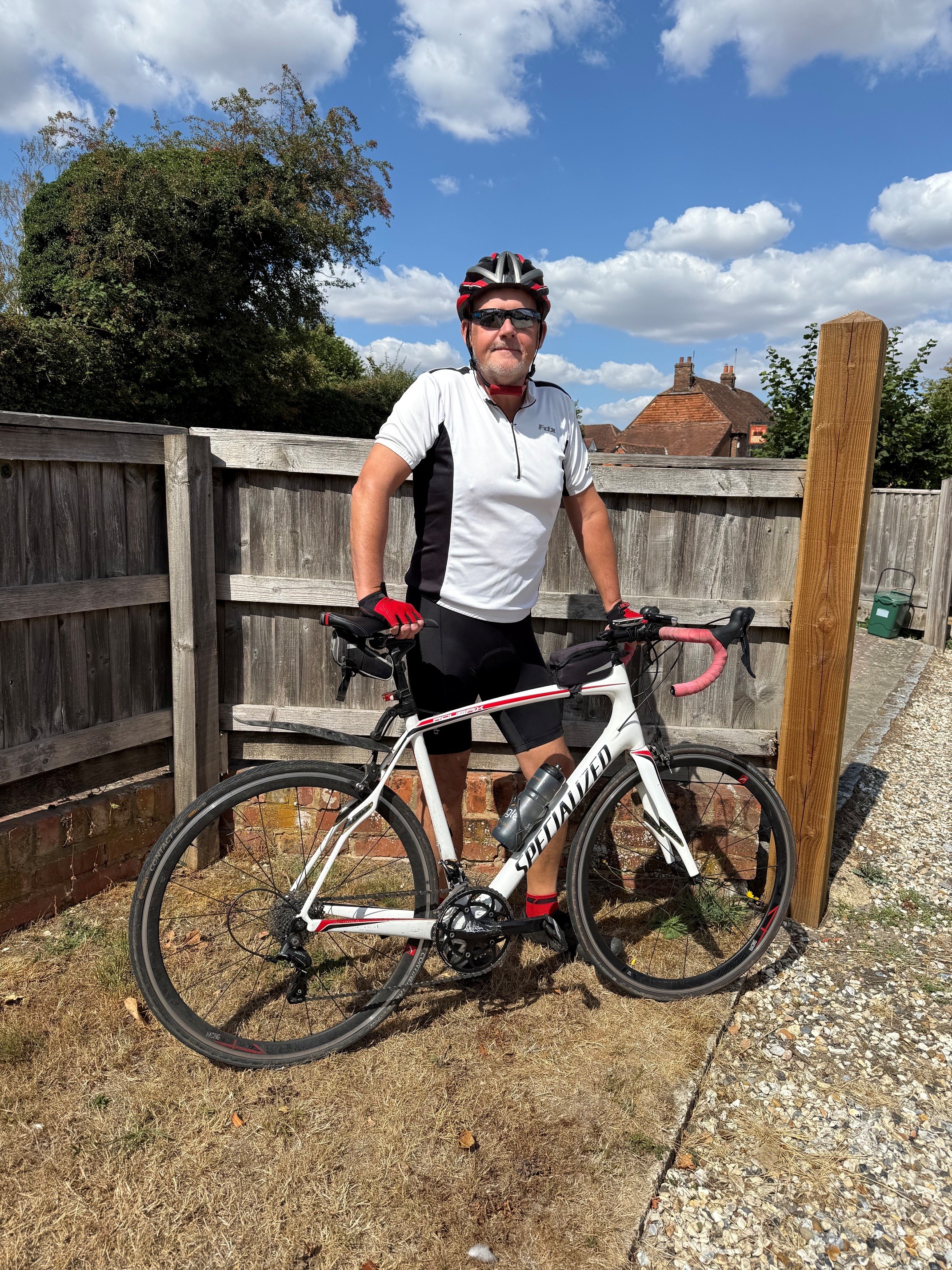 Glyn Howells outside with his bike
