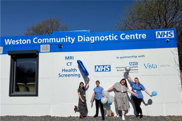 Staff pose outside Weston Community Diagnostic Centre with balloons