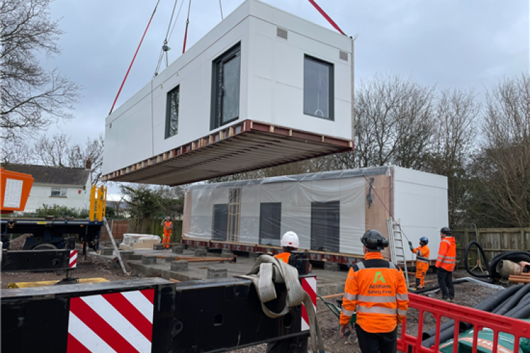 Construction workers overseeing Weston Community Diagnostic Centre unit being lifted by crane