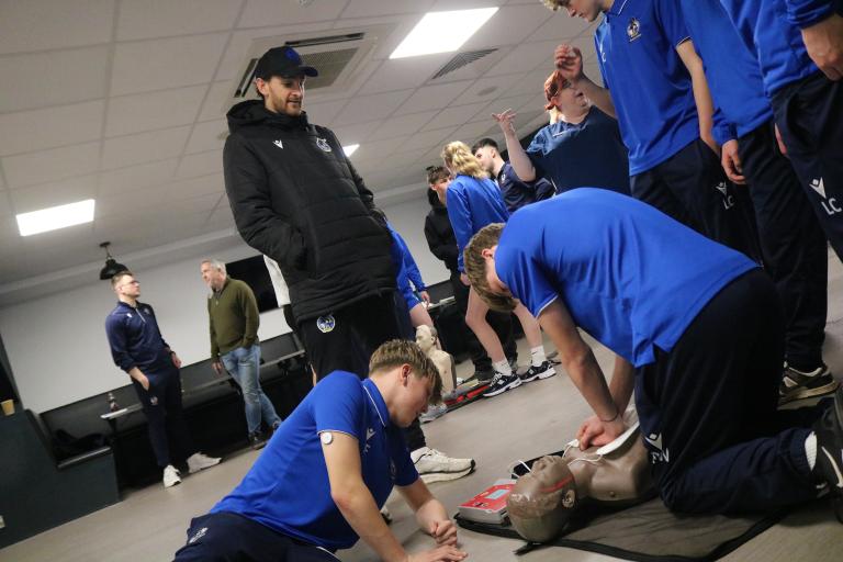 Students from Bristol Rovers Community Trust college practice CPR on training mannequins at the Memorial Stadium. Image by Bristol Rovers Community Trust