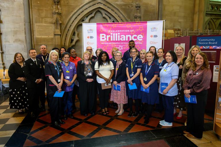 Group photo of nurses and smiling at the Brilliance service nursing and midwifery