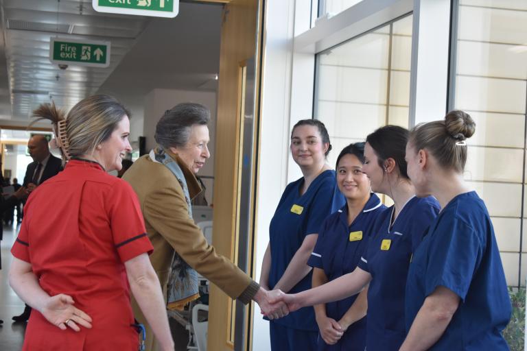 Her Royal Highness The Princess Royal shakes hands with 4 healthcare professionals at Southmead Hospital