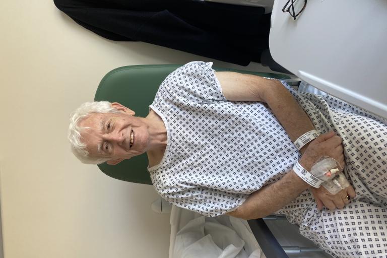 Patient Keith Middleton smiling on treatment chair