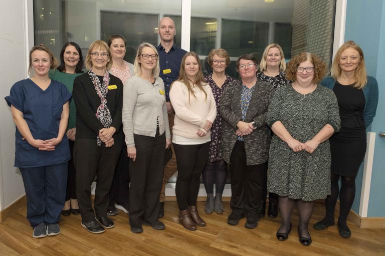 Muscular Dystrophy UK team smile for group photo