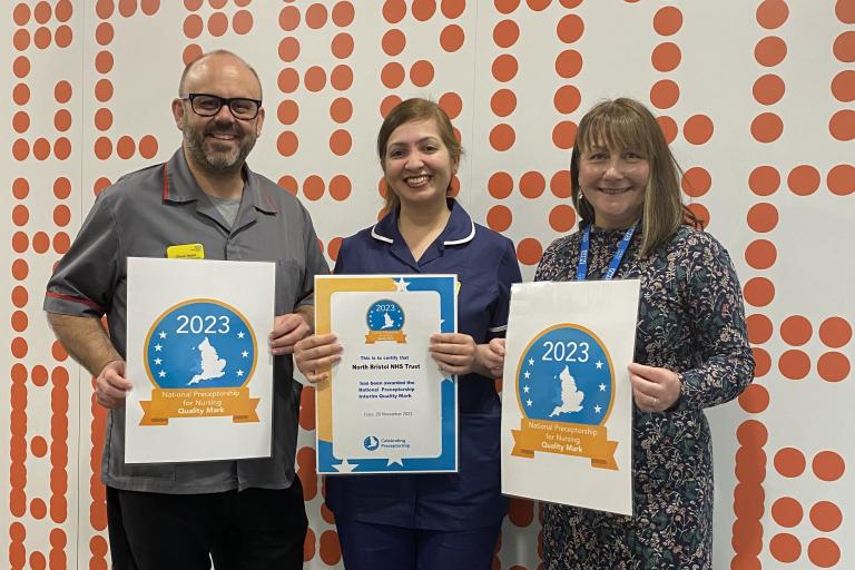 Steve Hams with two preceptorship team members holding up their certificates