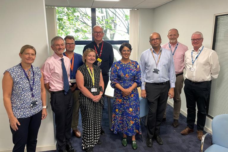 Group photo of Professor Meghana Pandit and Dr Trevor Smith with University Hospitals Bristol and Weston Foundation Trust colleagues