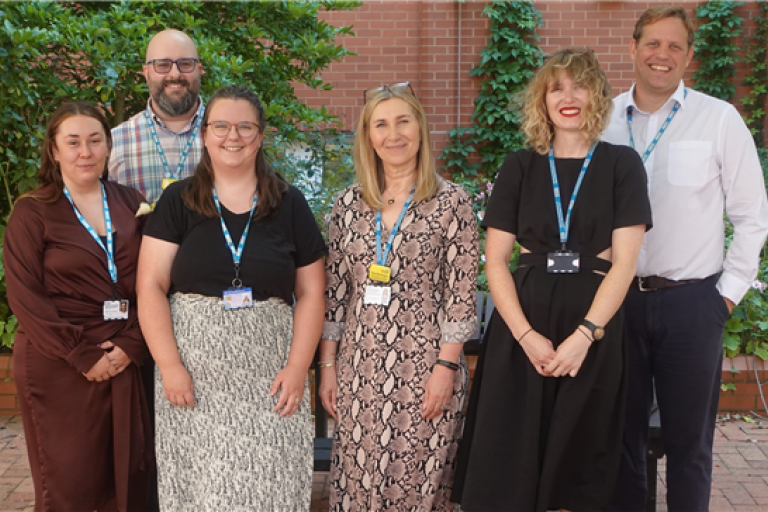 group photo of the Central Outpatients team at Bristol Royal Infirmary