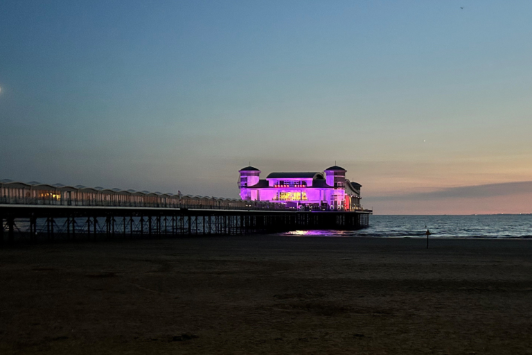 Weston Super Mare Grand Pier at sunset lit up in purple for World Hepatitis Day 2026