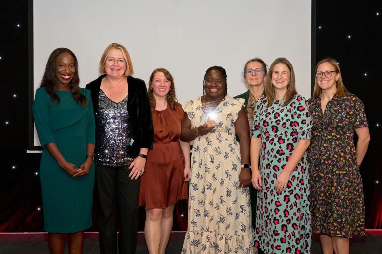 The CRF team collect their award from Kyla