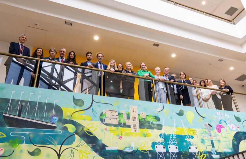 Colleagues posing for group photo in the Central Health Clinic in Bristol
