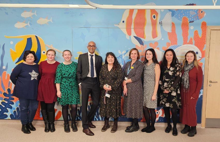 Bristol Royal Hospital for Children research team pose for group photo outside the The Coral Reef research centre