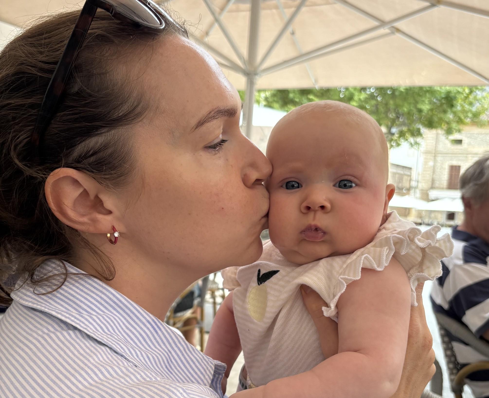 Jessica gives baby Clemmie a kiss on the cheek